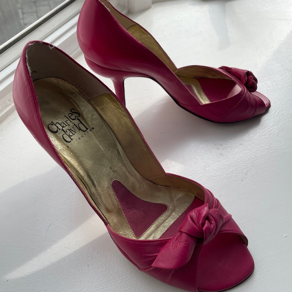 Fuschia leather Charles David peep-toe pumps.